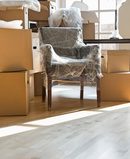 Protected chair in the middle of moving boxes